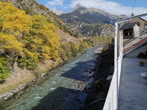 Enjoy breathtaking views of the river and surrounding mountains from this balcony.