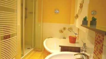 Bathtub, hair dryer, towels, soap