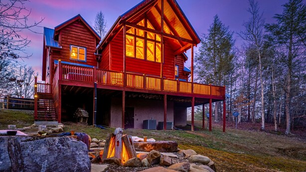 A log cabin with a covered porch and a fire pit. - Booking Summer! 4 Masters Family Friendly Hot Tub Fire Pit Secluded Yard (Sevierville)