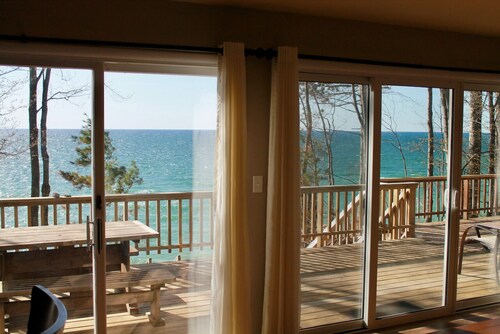 6 bedroom Cottage on Lake Michigan. Stairs to private, sandy beach. Huge Deck.