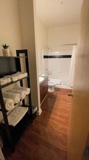 Combined shower/bathtub, hair dryer, towels, soap