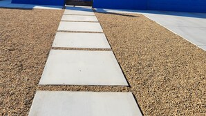 A pathway leading to a blue building with a garage door. - The Dorado Blue ~Spectacular views (Bullhead City)