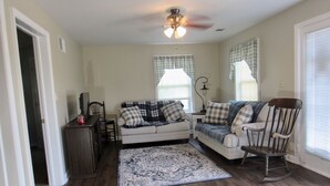 A living room with a sofa, a rocking chair, a coffee table, and a rug. - ❤️ Romantic Couples Retreat in the country❤️Farm Stay  (Ephrata)