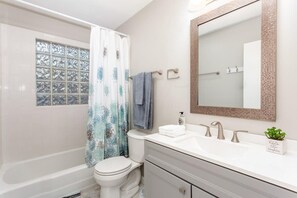 Bathtub, hair dryer, towels