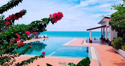 Beautifully furnished 1-bedroom condo on the beach with sea & mountain views