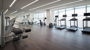 A modern gym with various exercise equipment, large windows, and a clean, spacious layout. - Shilla Stay Seobusan (Busan)
