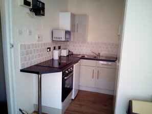 Apartment | Private kitchen | Fridge, microwave, oven, stovetop