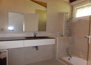 Bathtub, jetted bath, hair dryer, towels