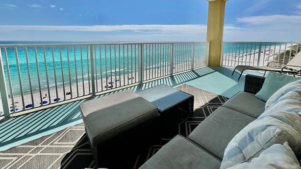 A balcony with a view of the beach, outdoor furniture, and a railing. - New to Rental Program, Low Floor, End Unit, Fabulous Views, Free Beach Chairs (Panama City Beach)