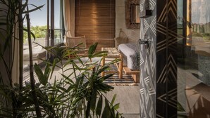 A modern interior with a large window, a wooden ceiling, and a seating area with a view. - Batukaru Private Pool Suite 3 (Canggu)