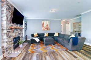 TV, fireplace, video games - Reluxme | 4BR Home w/Backyard Near Carowinds (Charlotte)