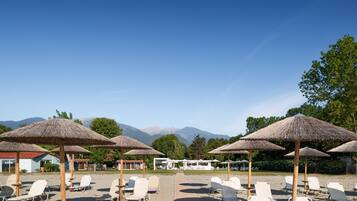 Private beach, white sand, sun loungers, beach umbrellas