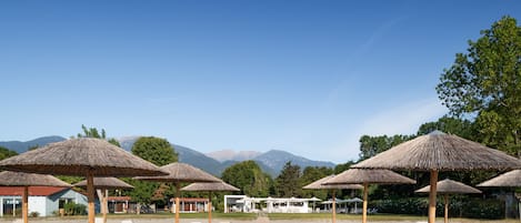 Private beach, white sand, sun loungers, beach umbrellas