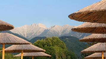 Private beach, white sand, sun loungers, beach umbrellas