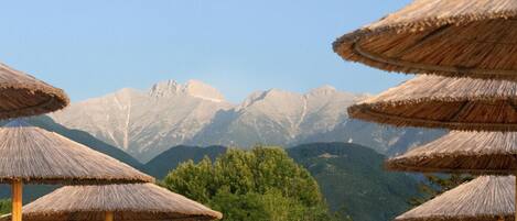Private beach, white sand, sun loungers, beach umbrellas