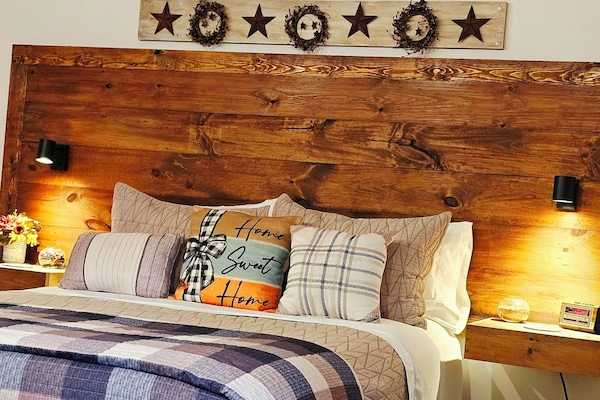 Queen bed provides luxurious bed linens and pillows for a restful nights sleep!