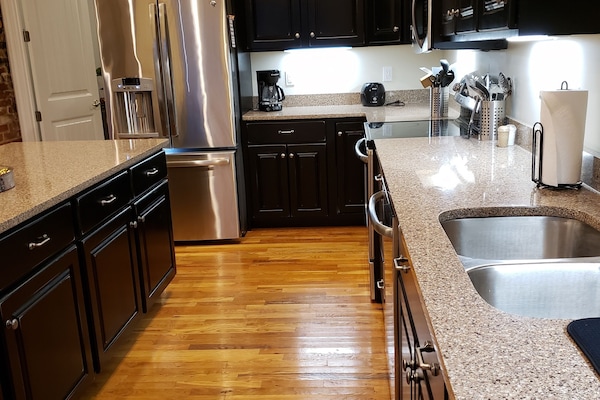 Spacious Kitchen with stainless steel appliances.