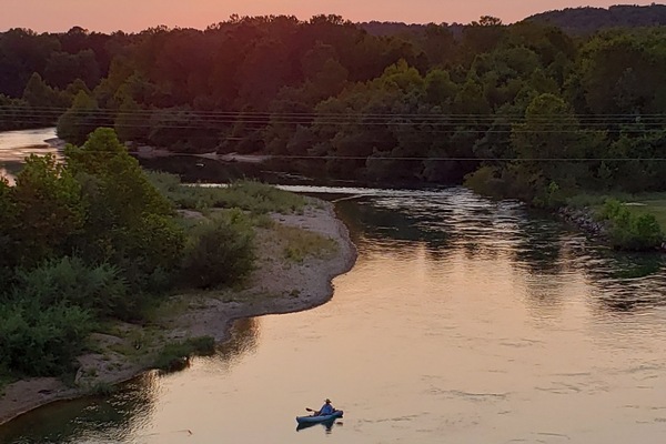 Sunset over Current River. Kayak in front of Condo.