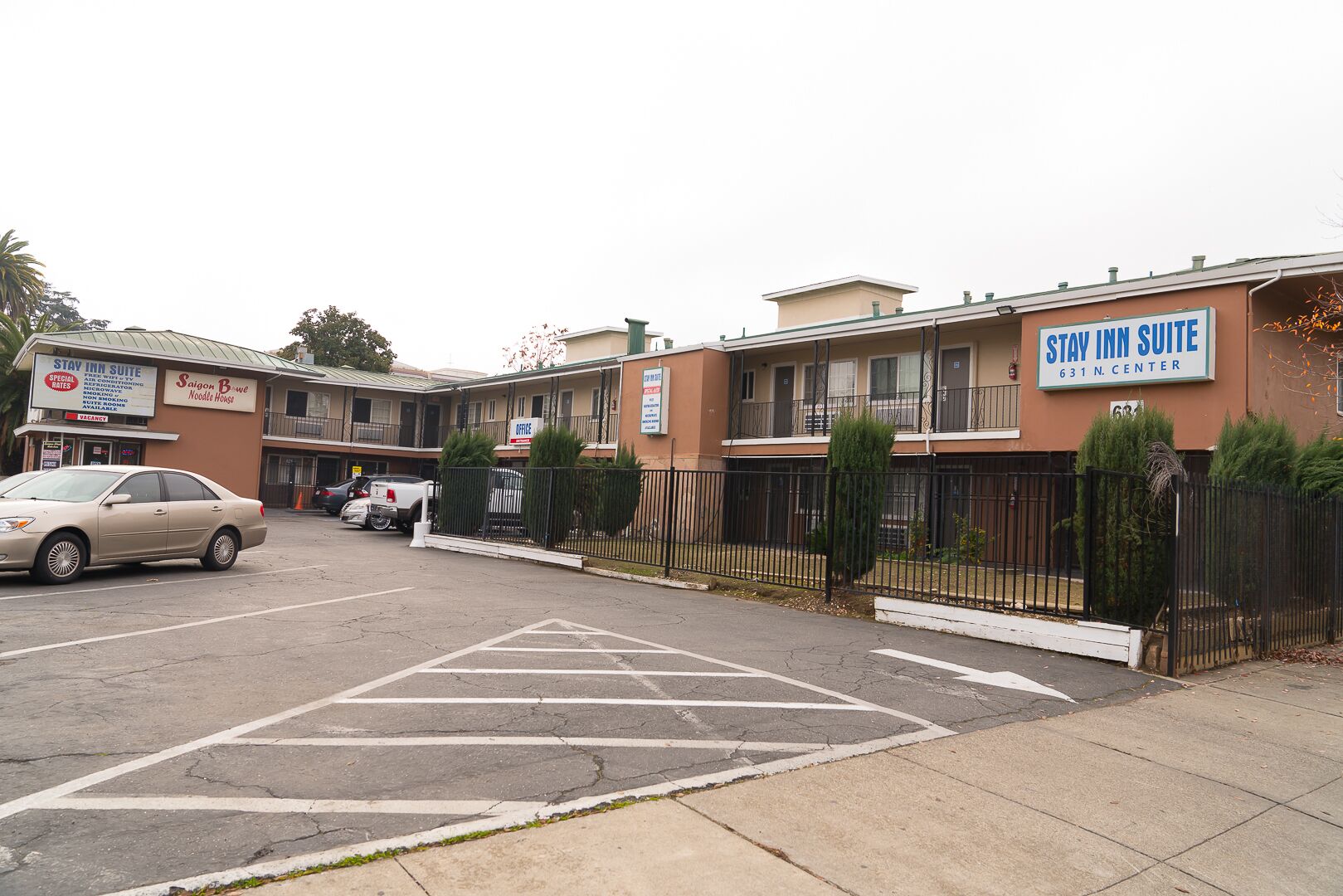 A Stay Inn Suite building with a sign indicating it is located at 631 N. Center.