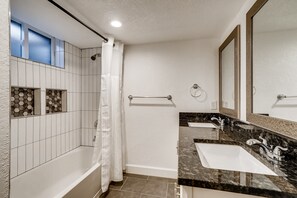 Combined shower/bathtub, hair dryer, towels, soap