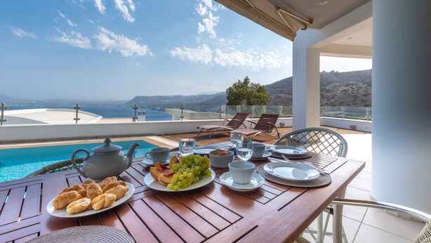 A table set for breakfast with a view of the sea and mountains. - Blue Oasis Luxury Villa (Malevizi)