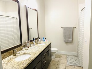 Combined shower/bathtub, hair dryer, towels, soap