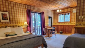 A cozy room with a bed, a desk, and a chair. - Cedar Plus - large room at The Inn At Mazama (Mazama)