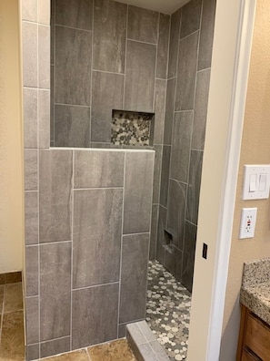 Combined shower/tub, hair dryer, towels, soap