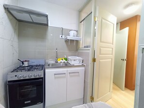 Comfort Apartment | Private kitchen | Full-size fridge, microwave, oven, stovetop
