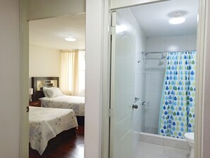 Shower, rainfall showerhead, designer toiletries, hair dryer