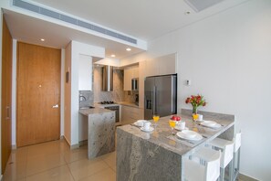 Fridge, oven, coffee/tea maker, cookware/dishes/utensils