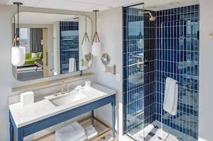 Shower, designer toiletries, hair dryer, bathrobes