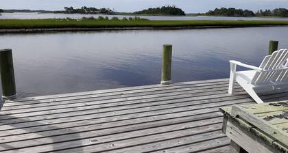 View of intracoastal waterway with private dock and boat lift.