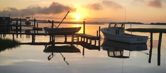 View of intracoastal waterway with private dock and boat lift.