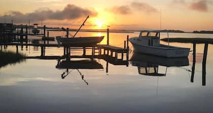 View of intracoastal waterway with private dock and boat lift.