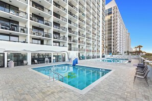 A hotel with a rooftop pool, multiple balconies, and a modern architectural design. - SunDestin 1BR Condo With Bright Open Living and Gulf Views - Unit 0409 (Destin)