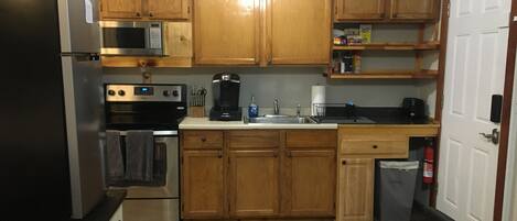 Microwave, coffee/tea maker, cookware/dishes/utensils