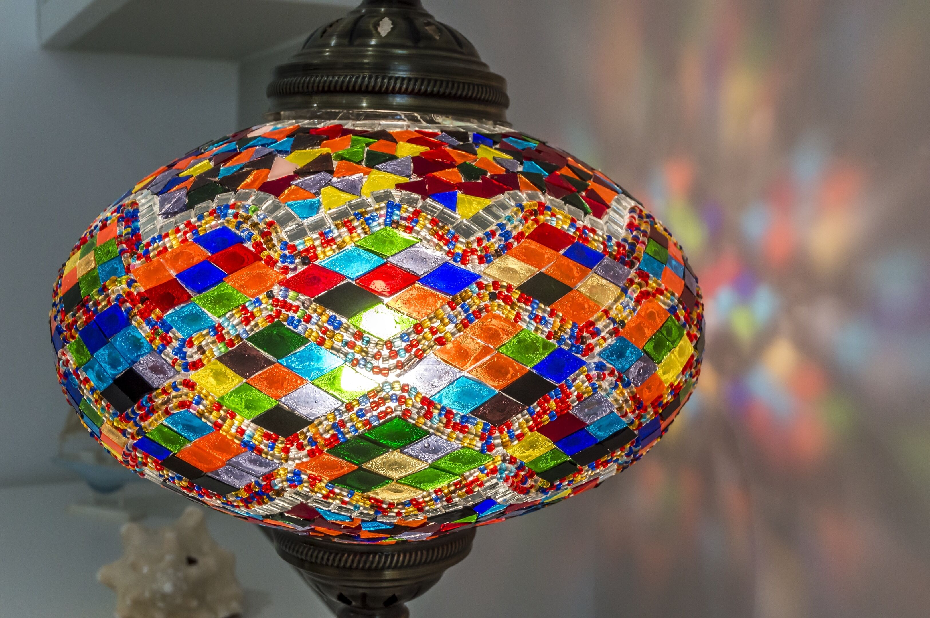 A colorful mosaic lamp with a geometric pattern.