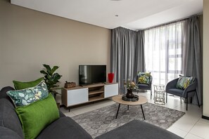 Classic Apartment | Living area | 32-inch flat-screen TV with cable channels, TV, Netflix