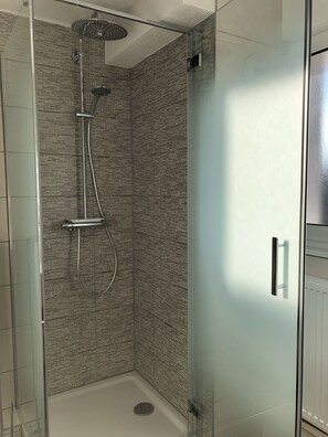 Shower, hair dryer, towels, soap