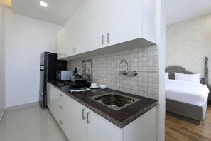 Fridge, microwave, stovetop, coffee/tea maker