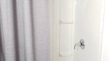 Combined shower/bathtub, hair dryer, towels, soap