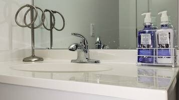 Combined shower/tub, hair dryer, towels, soap