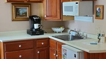 Fridge, microwave, coffee/tea maker, paper towels