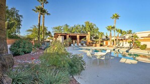 A pool area with lounge chairs, a pergola, and palm trees. - Central Tucson Gated Retreat (Tucson)