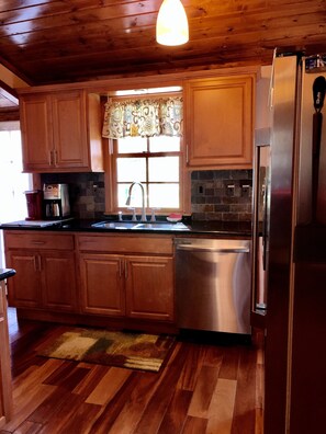 Microwave, dishwasher, coffee/tea maker, cookware/dishes/utensils