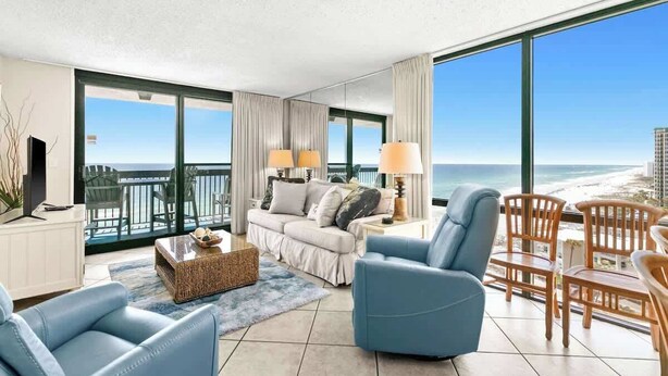 A modern living room with a large balcony overlooking the beach. - SunDestin Resort Unit 1212 (Destin)