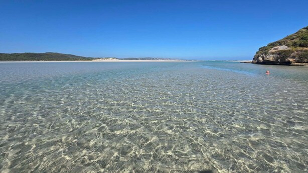 A clear coastal view with a sandy beach and rocky cliffs. - A beautiful chalet in a secluded bush environment, only a short walk to town. (Denmark)