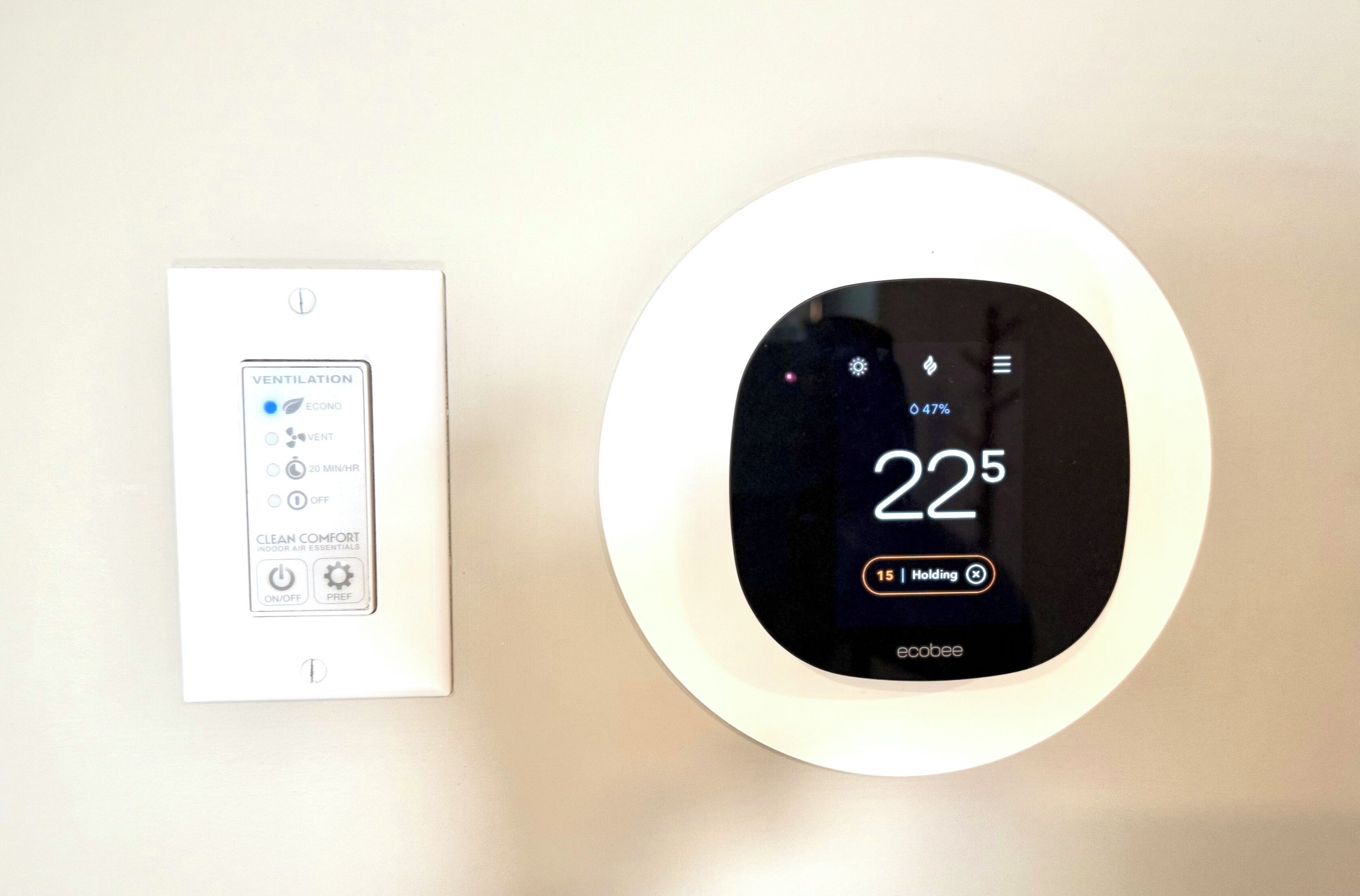 A thermostat and a control panel with ventilation settings.