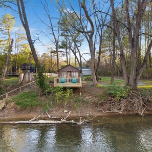 Property grounds - Spacious 9-bedroom waterfront retreat on over 2 private acres with above-ground pool, firepit, gazebo right on Shenandoah River, Theater Room, and detached garage with second kitchen and pool table. (Shenandoah)